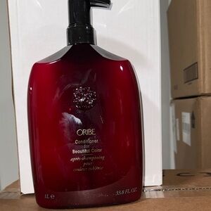 Oribe Conditioner in Deep Red Bottle